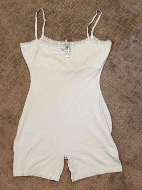 Skims Fits Everybody white ribbed lace onesie.